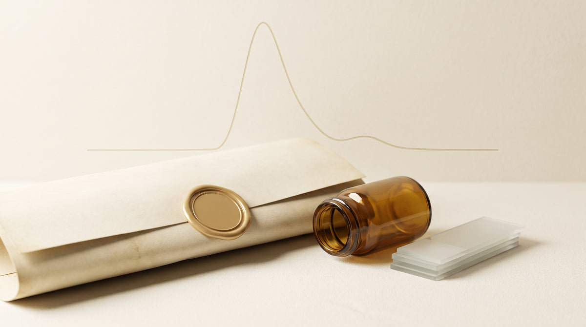 An amber glass laboratory vial resting beside a sealed parchment document and stacked glass slides, with a faint chromatography curve motif in the background, in warm gold and ivory tones.